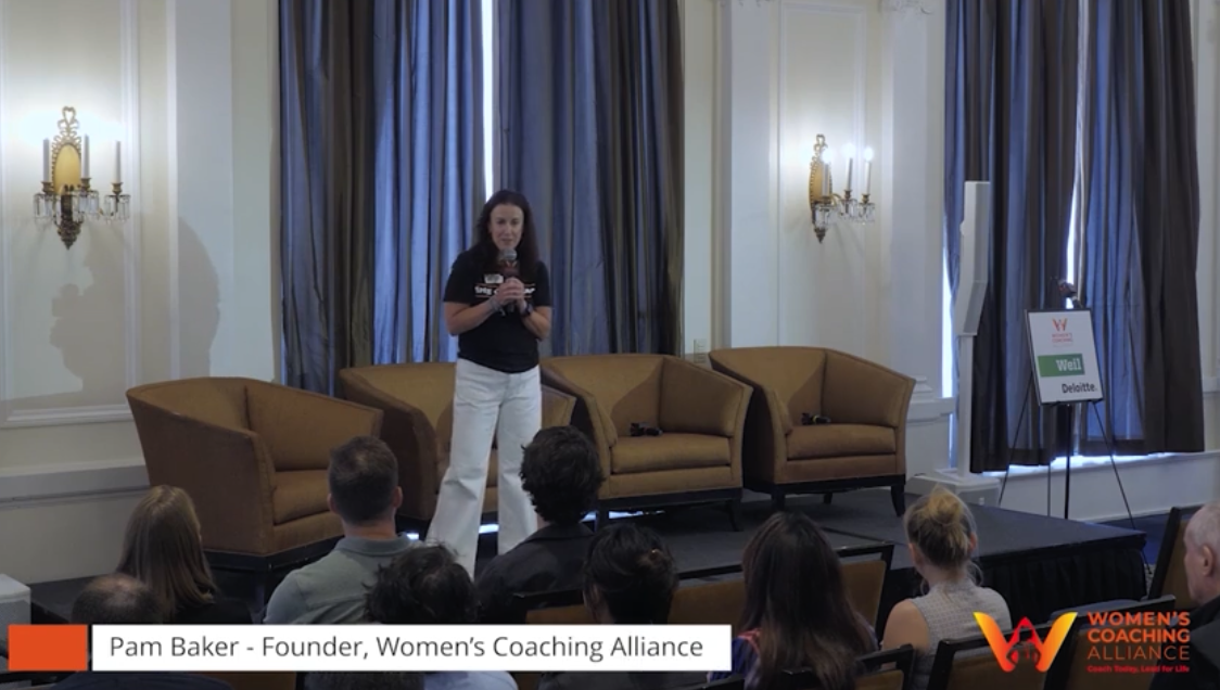 Speaker on stage captured with a lower-third title graphic